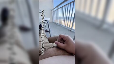 Chub jerks uncut dick on beach hotel balcony