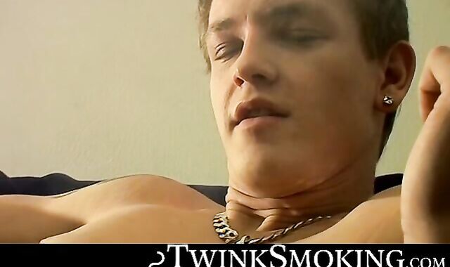 Bad stud Tomy chainsmoke his red cig while jerking on the couch