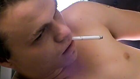 Tattooed Holden pullout cock and shoots load on his chest while blowing smoke