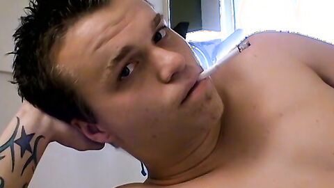 Tattooed Holden pullout cock and shoots load on his chest while blowing smoke