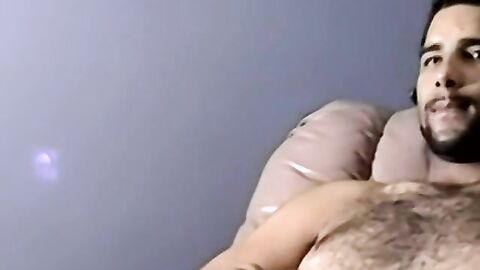 Bearded dude with hair on chest jerks off in amateur video