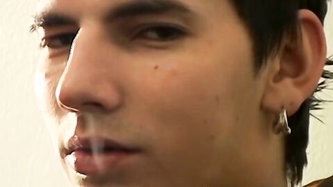 Hung Antony puffs his cigarette while stroking his big dick