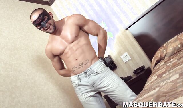 Masked muscular stud uses fleshlight on massive cock