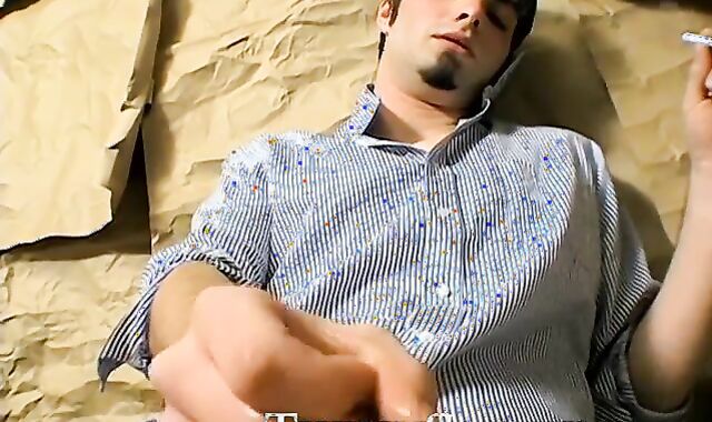 Hottie Ashley firing up his smoke before stroking his big dickÂ