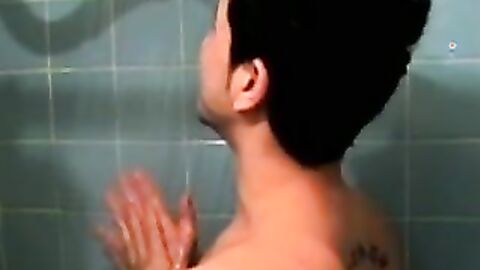 Amateur tattooed twink with a tan showers in classics porn