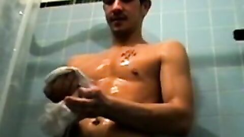 Amateur tattooed twink with a tan showers in classics porn