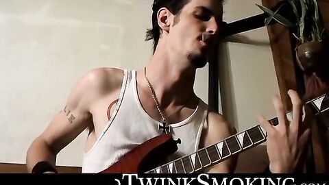Straight rocker Axel plays his guitar and his throbbing cock with his pack of cigaret