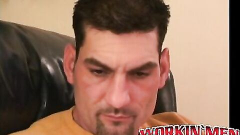 Rugged stud jerks off vigorously with toy in his tight ass