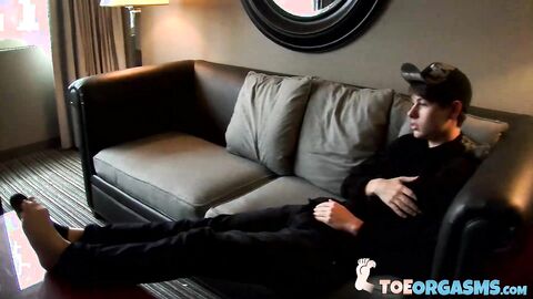 Sexy young twink Dustin loves jerking off and showing foot while watching porn