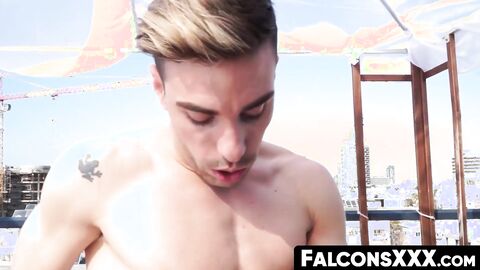 FalconsXXX.com - Gay studs engage in cock sucking and raw anal on a rooftop
