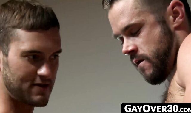 GayOver30.com - Sexy hunk Mike fucks cute Austin through the glory hole relentlessly
