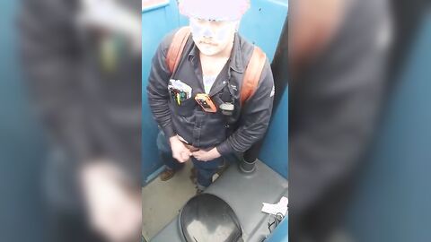 Bearded Hunk Strokes Cock Outdoors in a Porty Potty