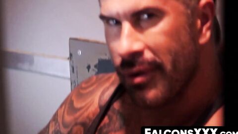 FalconsXXX.com - Two horny guys blowing each others dicks through a glory hole in a h