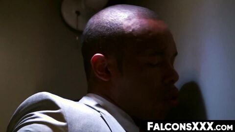 FalconsXXX.com - Two horny guys blowing each others dicks through a glory hole in a h