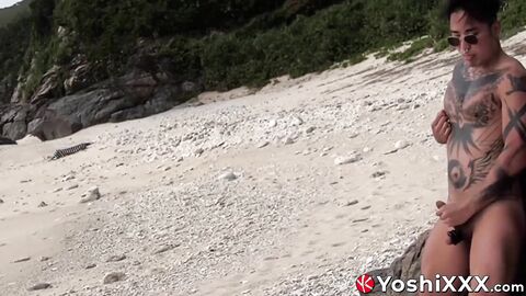 Naughty Japanese Yoshi Kawasaki tugs his cock and cums on the beach