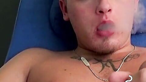 Handsome blonde explores his ass while blowing smoke