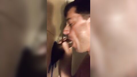 Amateur sucks big black cock at glory hole