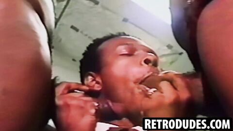 RetroDudes.com - Extremely aroused Rolph Coral savagely consumes two dicks at the sam