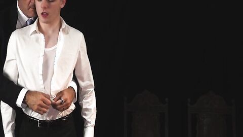 Ethan Tate fulfills his master's lustful desire in the darkroom