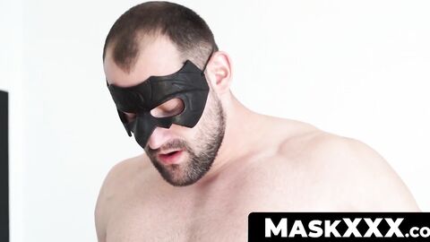 MaskXXX.com - Huge muscular dude with a mask enjoys a expertly delivered handjob
