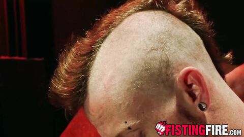 Tatted Kyle Wood jacks off his stone hard cock while using a sounding rog on it