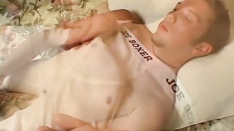 Cute man lays back and tugs on his vascular cock and moans