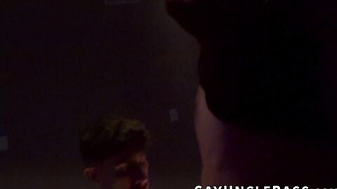 Ty Santana and Kyle Michaels enter a dark room filled with horny men