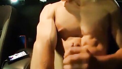 Big-Cocked Man Strokes in Car While Watching Porn