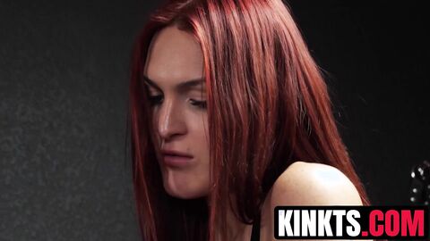 Redhead tranny Tori Easton slaps and ass pounds her restrained sub