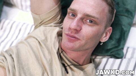 Handsome Martin Spell strokes his cock on the bed in hot solo tease