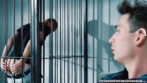 Dirty cop Luka Sage fists prisoner Josh Mikael on the precinct desk