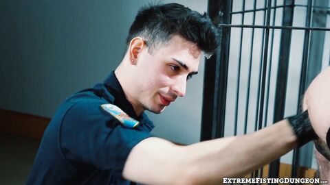 Dirty cop Luka Sage fists prisoner Josh Mikael on the precinct desk