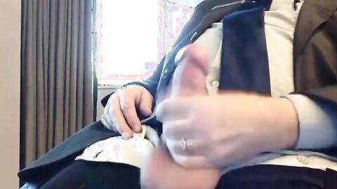 Suited Silver Fox Jerks Off Solo