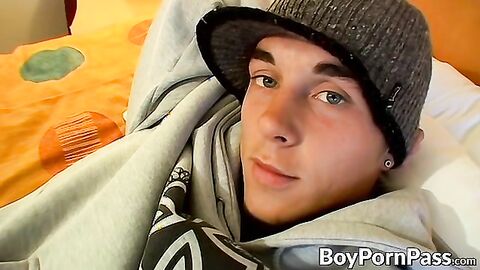 Tattooed young guy Kelly Cooper jacks off his long hard dick