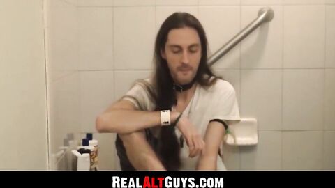 RealAltGuys.com - Long-haired stud strokes his cock intensely while relaxing in the b