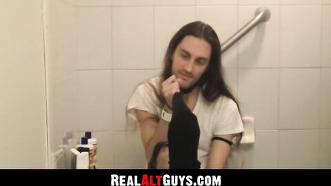 RealAltGuys.com - Long-haired stud strokes his cock intensely while relaxing in the b