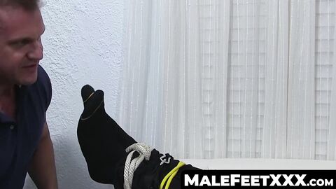 MaleFeetXXX.com - Bound hunk endures feet licking and toe sucking from master