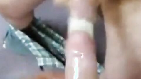 Two Guys Cum Together in a Condom