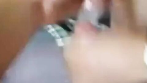 Two Guys Cum Together in a Condom