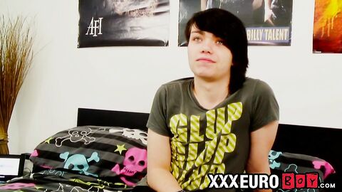 Young gay man with long hair strokes it hard