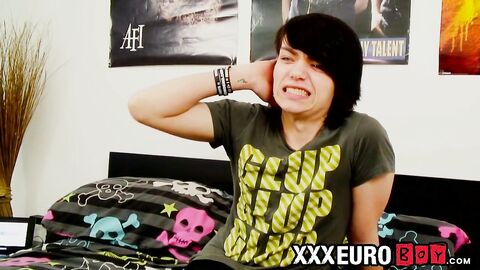 Young gay man with long hair strokes it hard