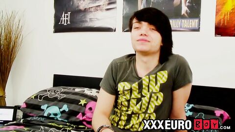 Young gay man with long hair strokes it hard