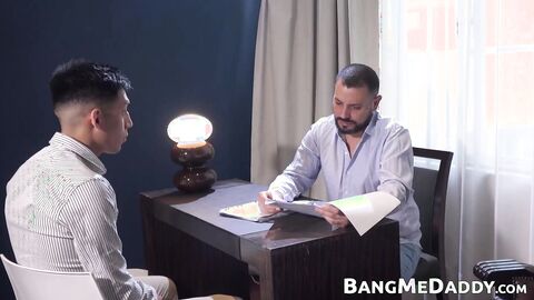 Petite twink Alejo gets on his knees to devour daddy Daniels cock