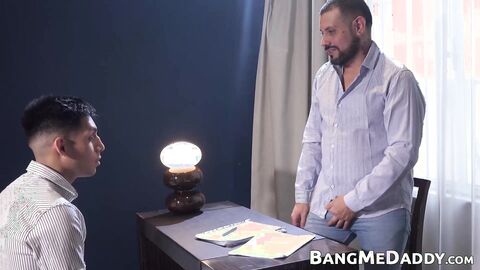 Petite twink Alejo gets on his knees to devour daddy Daniels cock