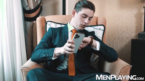 Youthful businessman Reno Gold pulls out his cock for stroking