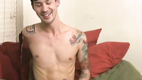 Tattooed Andrew blows a hot load after rubbing and stroking his long dick