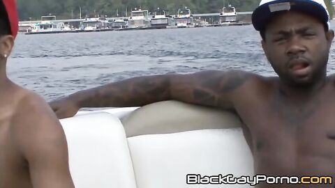 Dallas Knight and Thugzilla show off their mighty fine bods while driving on a boat