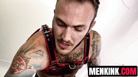 Hairy Christian Wilde in leather clothing wanks his hard cock until cumshot