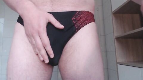 Big Cock Bear Cums in Speedo Bulge