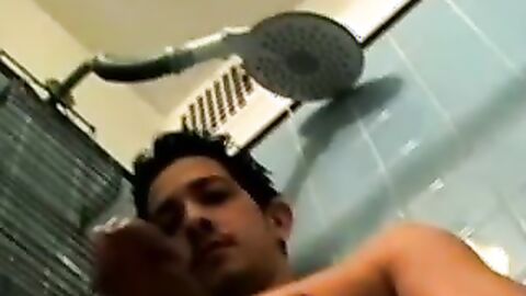 Dirty guy Justin oozed cum after wanking his long hard cock in the bathroom